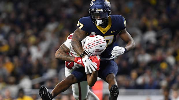 Dec 2, 2023; Detroit, MI, USA; Toledo Rockets cornerback Quinyon Mitchell (27) breaks up a pass intended for Miami (OH) Redhawks wide receiver Gage Larvadain (10) in the third quarter at Ford Field. Mandatory Credit: Lon Horwedel-USA TODAY Sports